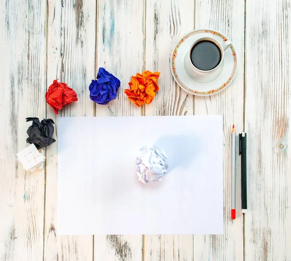 Concept - no idea, Empty notebook on wooden table with crumpled papers around — Stock Photo, Image