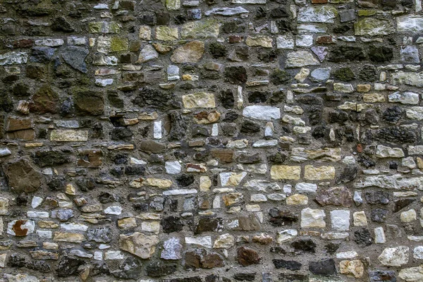 Gamla stenmuren som bakgrund eller konsistens. — Stockfoto