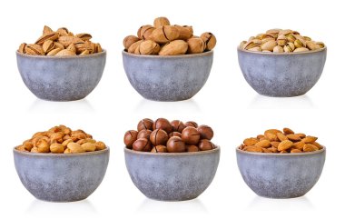 Beyaz izole bir arkaplan üzerinde kırpma yolu olan çeşitli fındıklar                       