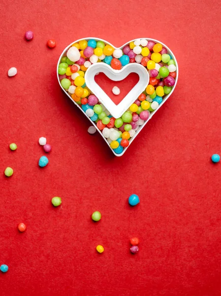 Creative layout of heart shape with colorful candies — Stock Photo, Image