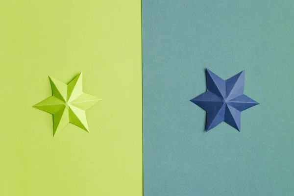 Colored paper stars over different background