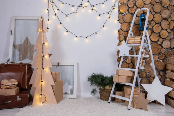 vintage interior of a photo studio with a stepladder and old suitcases, books and lanterns