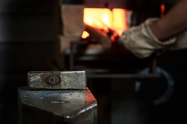 Creating iron tools in blacksmith's on the old plank wood table — Stock Photo, Image