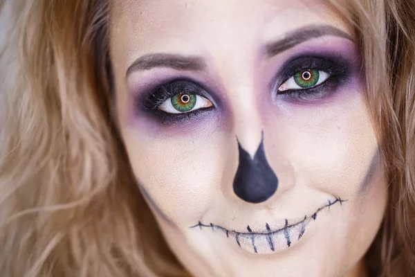 Halloween. Portrait of young beautiful girl with make-up skeleton on her face — Stock Photo, Image