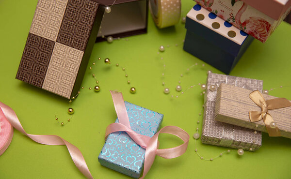  Gift box preparation on green background
