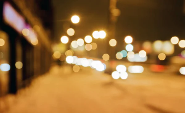 Winter night street background with bokeh lights