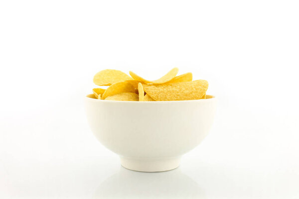 potato chips on bowl on yellow background.