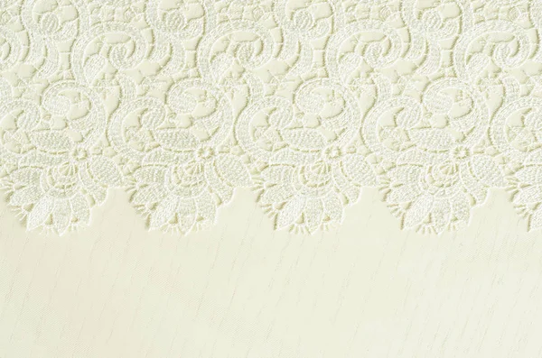 White embroidered lace on white wood Stock Photo
