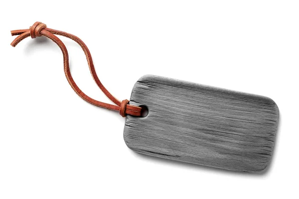Wooden grey label with genuine leather cord — Stock Photo, Image