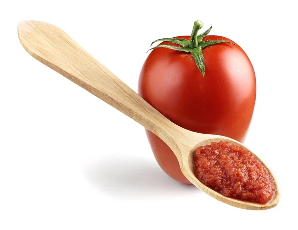 Tomato with wooden spoon — Stock Photo, Image