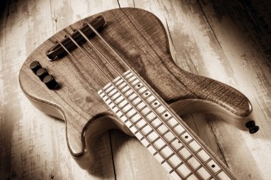 solid body micro bass guitar,sepia image clipart