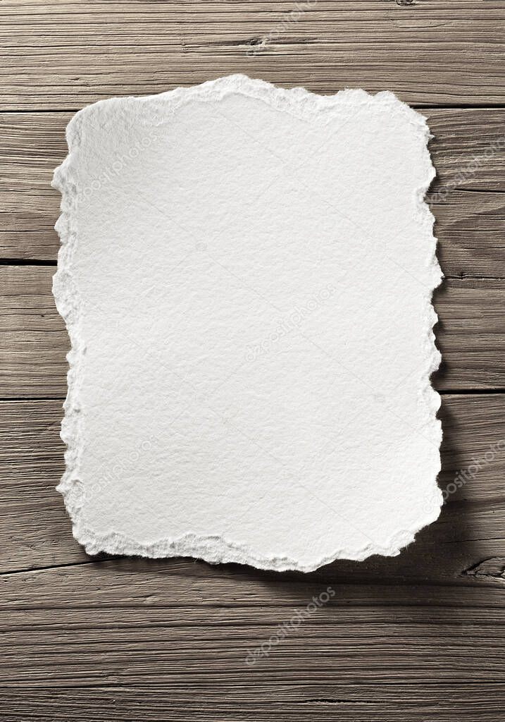 blank white note paper on aged wooden wall