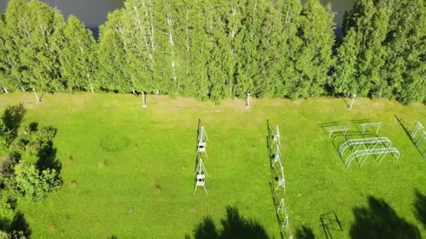 Top view of suburban sports ground on banks of river in summer Sunny day — Stockvideo
