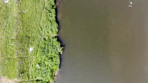 4k Aerial top down view of people swimming in the river on a hot summer day — 비디오