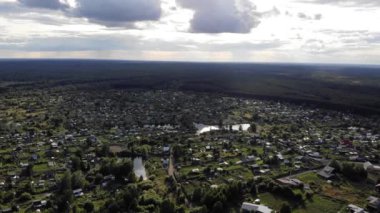 Aerial stock footage of countryside homes overlooking lake in summer Sunny day