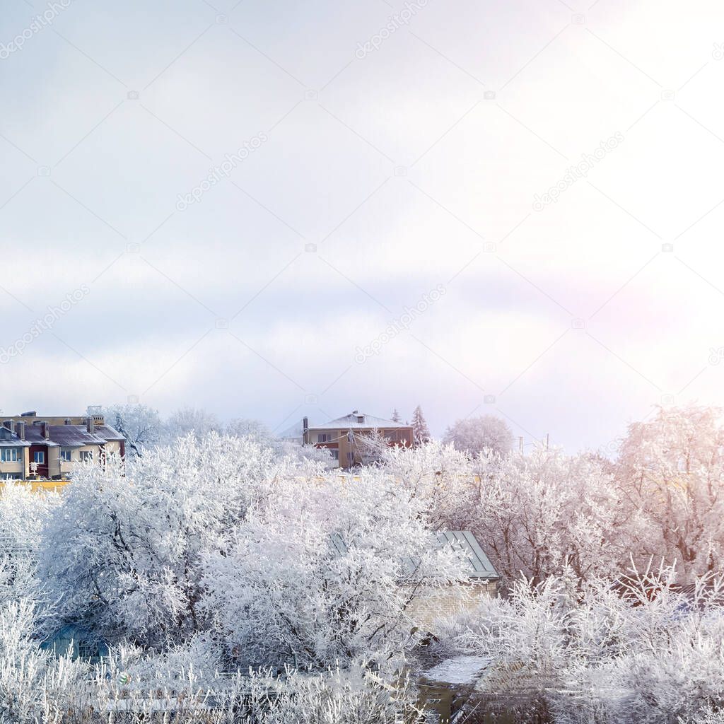 winter city landscape with snow and blue sky
