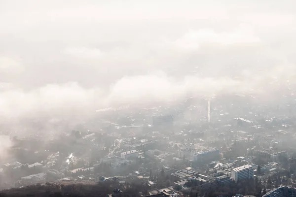 aerial view of the city through the clouds