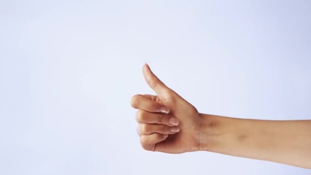 Female hand show thumbs up gesture. Woman hand rise OK, good sign closeup isolated at white screen background — Stock Video