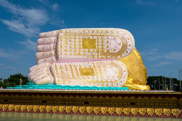 Feet of reclining Buddha name Naung Daw Gyi Mya Tha Lyaung in Bago, Myanmar.