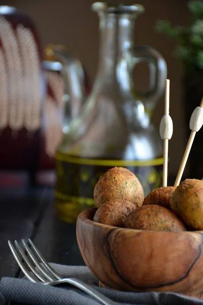 Fritters of cod home in a bowl of wood — Stock Photo, Image