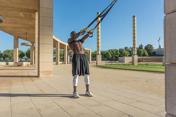 Male muscular training with system trx — Stock Photo, Image