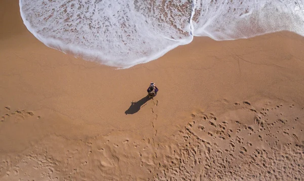 View aerial of a single beach where there is a person walking — Stock Photo, Image