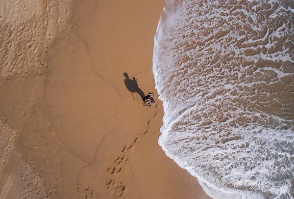 View aerial of a single beach where there is a person walking — Stock Photo, Image