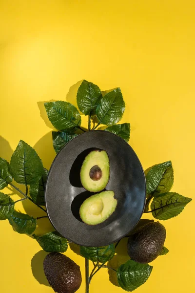 Avocados cut on a background of color — Stock Photo, Image