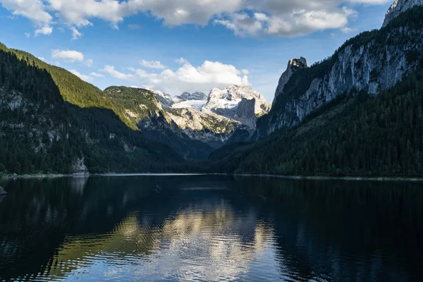 Lake Gosausee is one of the most beautiful places in Austrian Alps, The scenery around is just breathtaking, you can see beautiful mountains around and also the Dachstein glacier. Tourism in Austria