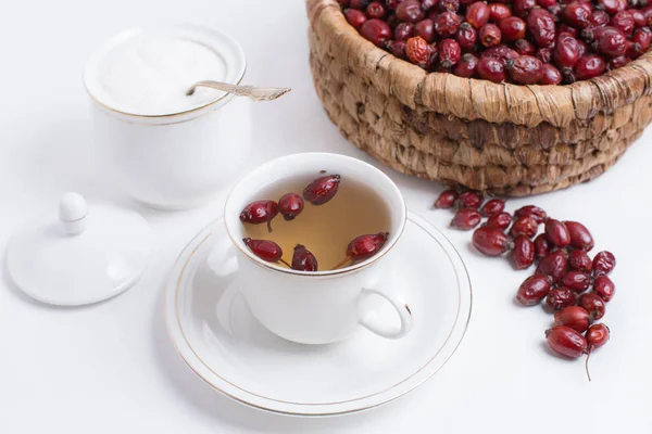 Tea from rosehip on a white background — Stock Photo, Image