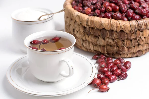 Tea from rosehip on a white background — Stock Photo, Image