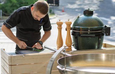 Barbecue chef tasting outdoor kitchens clipart