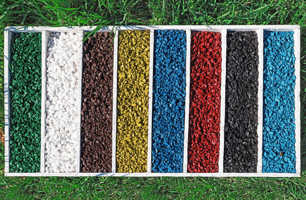 colorful rocks in wooden box On the green grass, art Aquarium Fish Tank Gravel Stones Color
