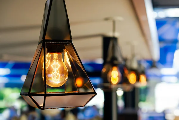 Burning an incandescent lamp with a large decorative spiral — Stock Photo, Image