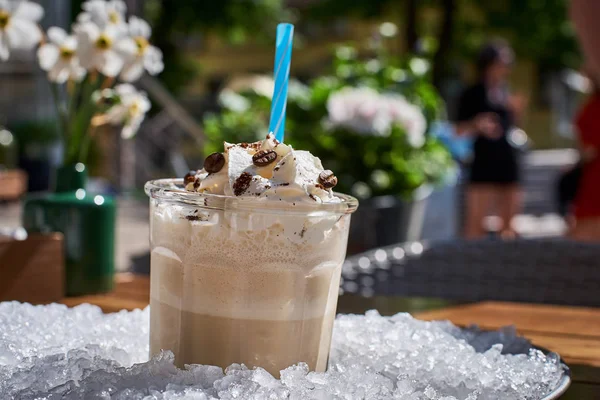 Glass of Iced coffee, on a pile of ice. selective focus with the ice — Stock Photo, Image