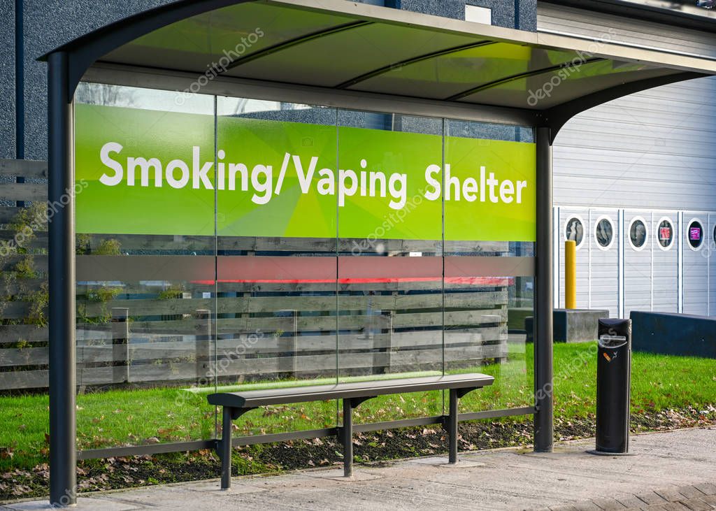 BIRMINGHAM, ENGLAND - DECEMBER 2019: Smoking and vaping shelter outside the Birmingham National Exhibition Centre.