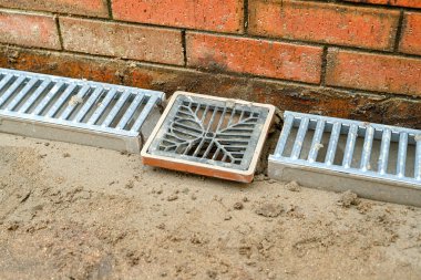 CARDIFF, WALES - FEBRUARY 2020: Drain and drainage channels laid as part of a patio in the garden of a residential property
