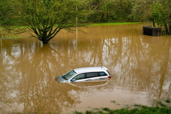 NANTGARW, NEAR CARDIFF, WALES - FEBRUARY 2020: Car submerged in storm water after the River Taff burst its banks near Cardiff. Heavy rain fell on South Wales from Storm Dennis.