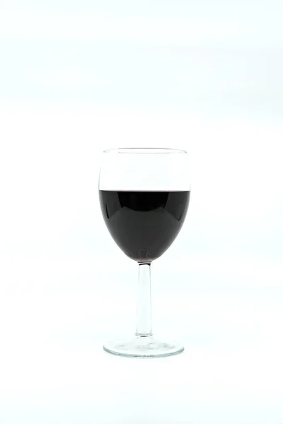 Glass of red wine on a plain white background with space for copy