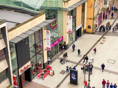 CARDIFF, WALES - MARCH 2020: Aerial view of the entrance to the Queen's Arcade shopping mall on Queen Street in Cardiff city centre.