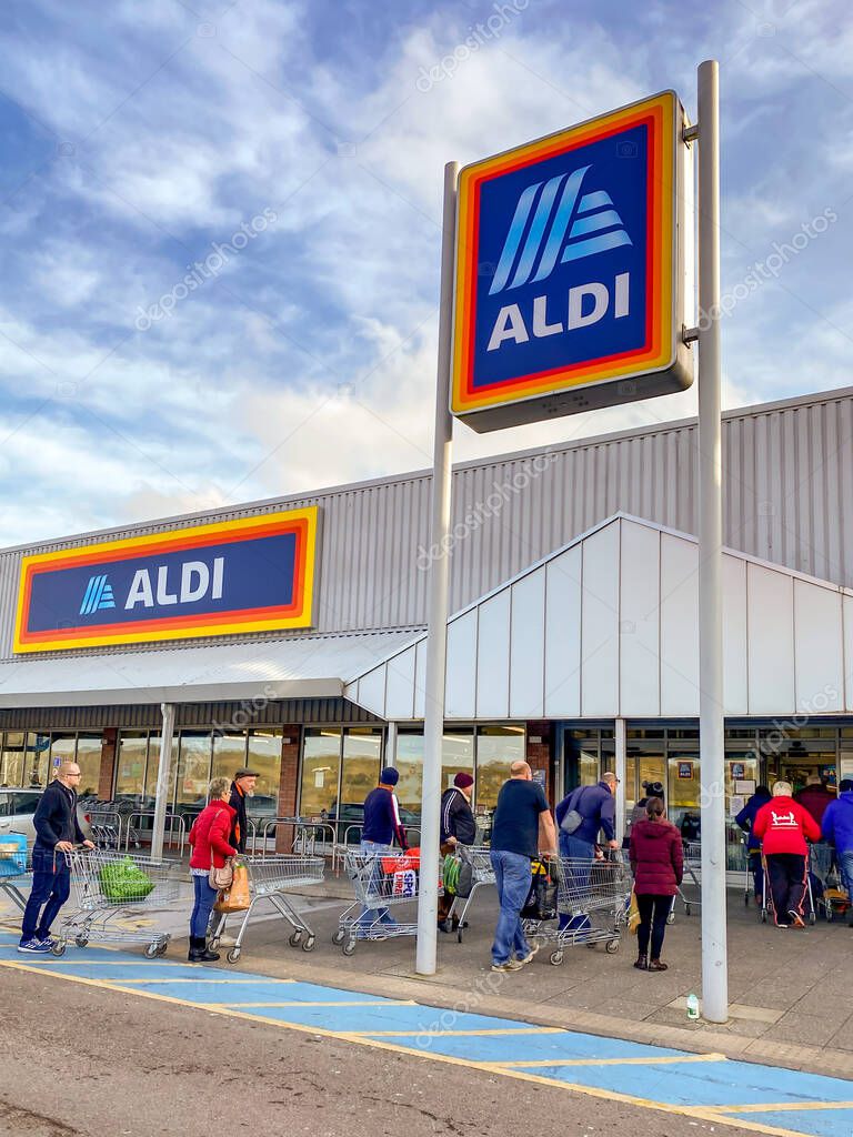 PONTYPRIDD, WALES - 21 MARCH 2020: People queuing to shop in an ALDI store in Pontypridd as worry about the impact of the coronavirus outbreak increases.