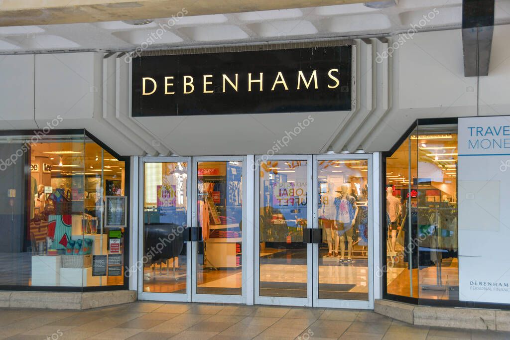 CARDIFF, WALES - JULY 2019: Signs above an entrance to Debenhams department store in Cardiff city centre