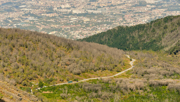NAPLES, ITALY - AUGUST 2019: Mountain road leading to the car parking near the summit of Mount Vesuvius on the outskirts of Naples.