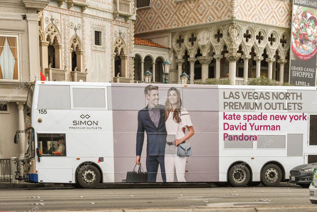 LAS VEGAS, NEVADA, USA - FEBRUARY 2019: Double deck public service bus coevered in advertising on Las Vegas Boulevard.