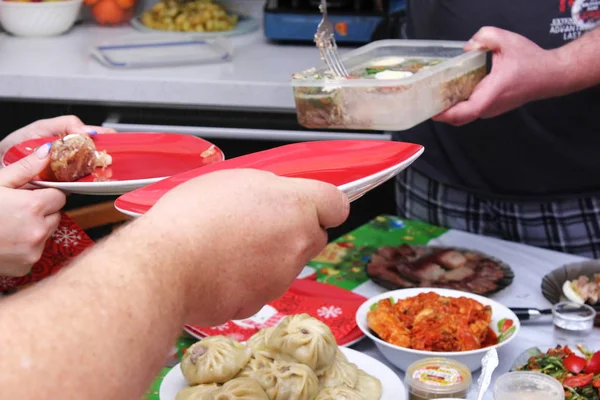 Russian feast. Traditional new year\'s dish jelly is laid out on plates.