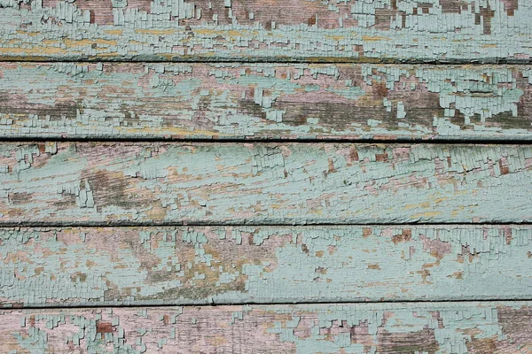 Old shabby wooden planks with cracked color paint. — Zdjęcie stockowe