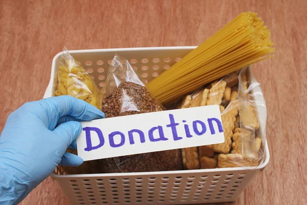 Una Mano Guante Goma Sostiene Inscripción Donación Una Caja Donaciones — Foto de Stock