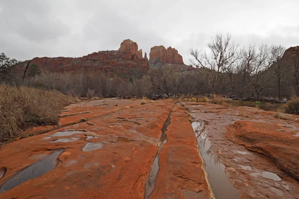 Cathedral Rock in Red Rock State Park outside of Sedona, Arizona on cloudy snowy winter day.