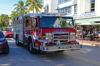 Brightly colored Miami Beach fire engine on Ocean Drive.