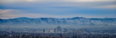 Panoramic view of Reno, Nevada skyline on overcast winter morning. clipart